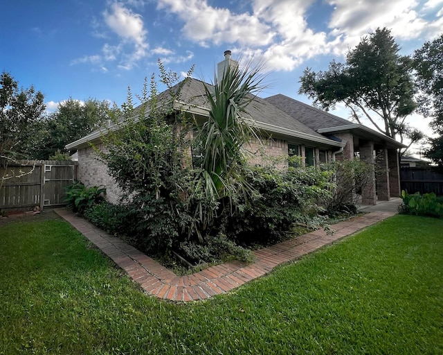 3002 Sandleigh Dr, Spring, TX 77388 - rear view of house with brick siding and a chimney