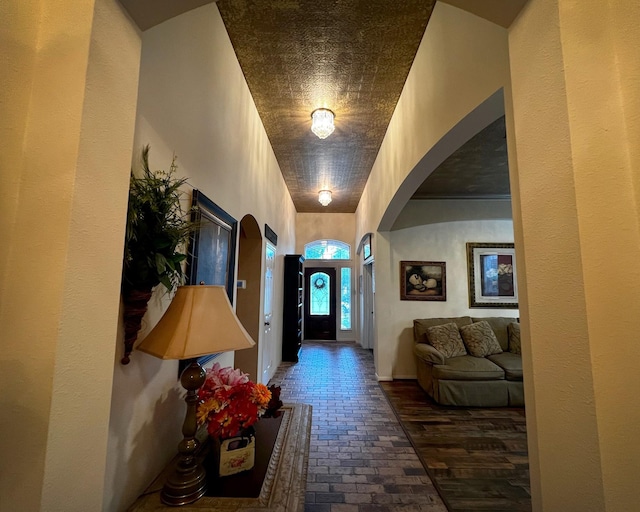 3002 Sandleigh Dr, Spring, TX 77388 - entryway with arched walkways and brick floors
