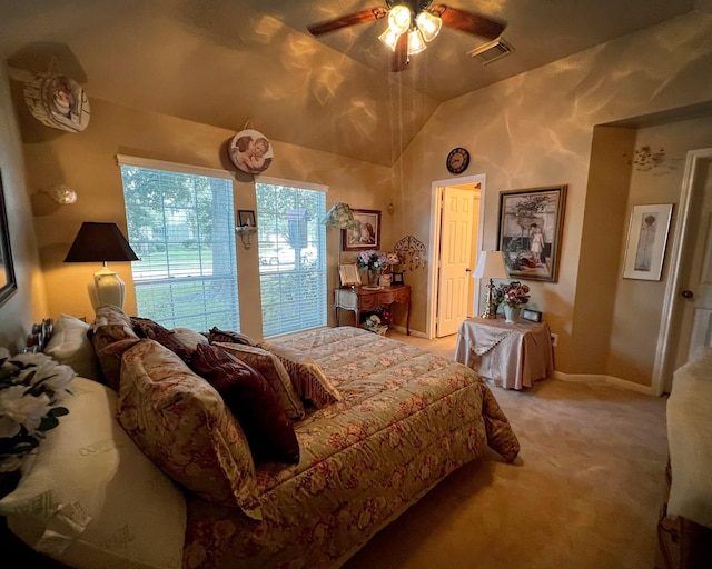 bedroom featuring light colored carpet, ceiling fan, baseboards, and lofted ceiling