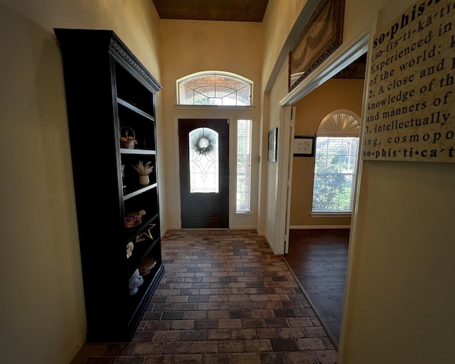 3002 Sandleigh Dr, Spring, TX 77388 - foyer with brick floors, healthy amount of natural light, and baseboards