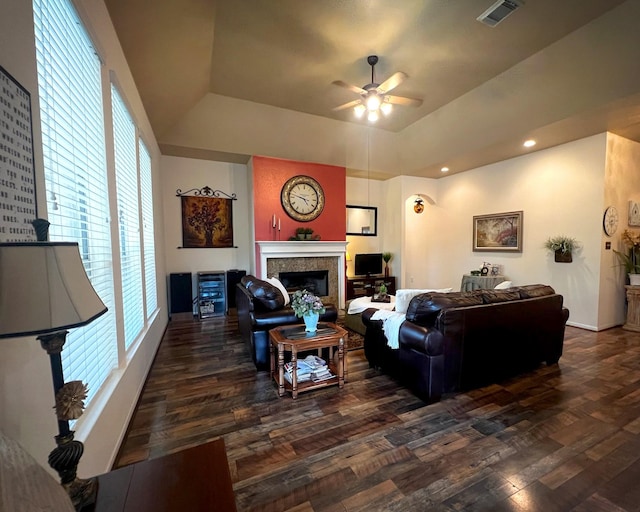 living room with ceiling fan, dark wood-style flooring, a glass covered fireplace, recessed lighting, and baseboards