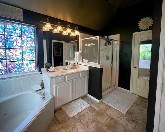 3002 Sandleigh Dr, Spring, TX 77388 - bathroom featuring a stall shower, vanity, a bath, and stone tile floors