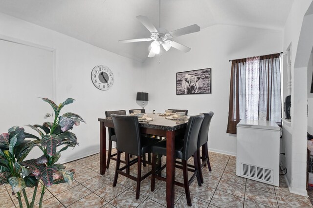 4914 Airport Blvd, Houston, TX 77048 - dining room with vaulted ceiling, ceiling fan, light tile patterned floors, and baseboards