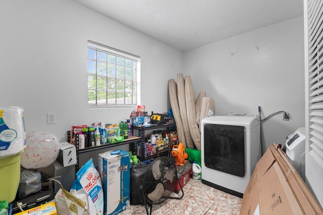 4914 Airport Blvd, Houston, TX 77048 - laundry room with hookup for an electric dryer and tile patterned flooring