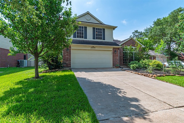 20423 Lone Star Oak St, Cypress, TX 77433 - traditional home with cooling unit, brick siding, a garage, concrete driveway, and a front yard