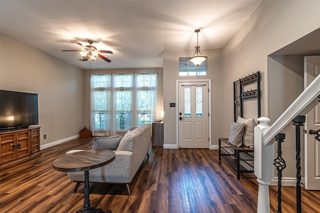 20423 Lone Star Oak St, Cypress, TX 77433 - foyer entrance featuring dark wood-style floors, ceiling fan, baseboards, and stairs