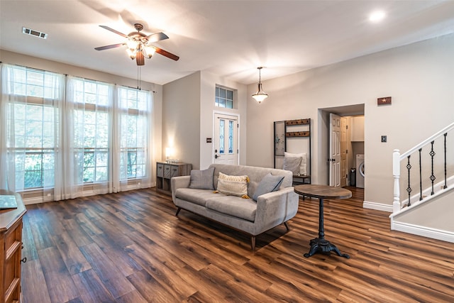 20423 Lone Star Oak St, Cypress, TX 77433 - living room featuring washer / clothes dryer, ceiling fan, dark wood-type flooring, and plenty of natural light