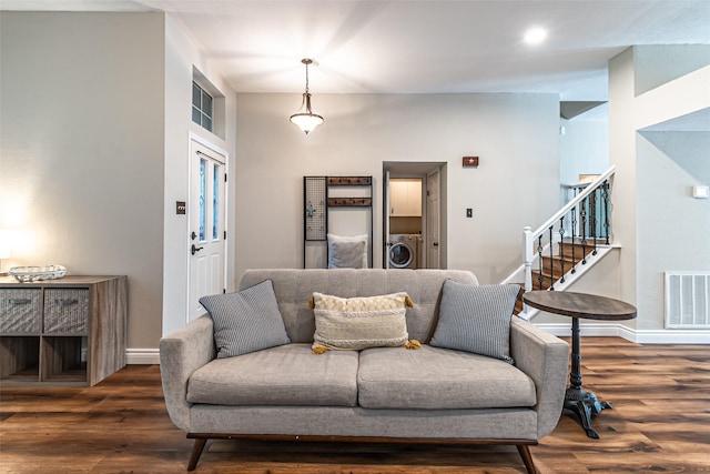 20423 Lone Star Oak St, Cypress, TX 77433 - living room with washer / clothes dryer, stairs, wood finished floors, and baseboards