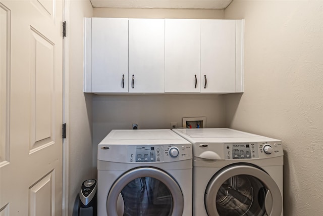 20423 Lone Star Oak St, Cypress, TX 77433 - laundry area with cabinet space and washer and clothes dryer