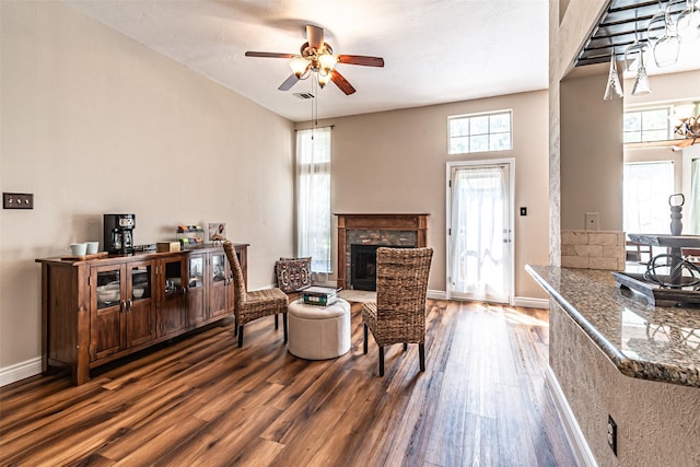 20423 Lone Star Oak St, Cypress, TX 77433 - living area with wood finished floors, a ceiling fan, a fireplace, and baseboards