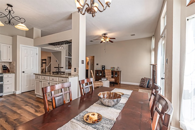 20423 Lone Star Oak St, Cypress, TX 77433 - dining room featuring dark wood-style flooring, stairway, a ceiling fan, and baseboards