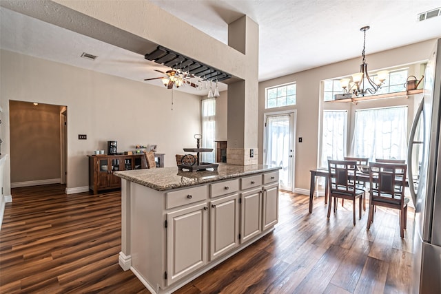 20423 Lone Star Oak St, Cypress, TX 77433 - kitchen with dark wood-type flooring, a chandelier, baseboards, and freestanding refrigerator