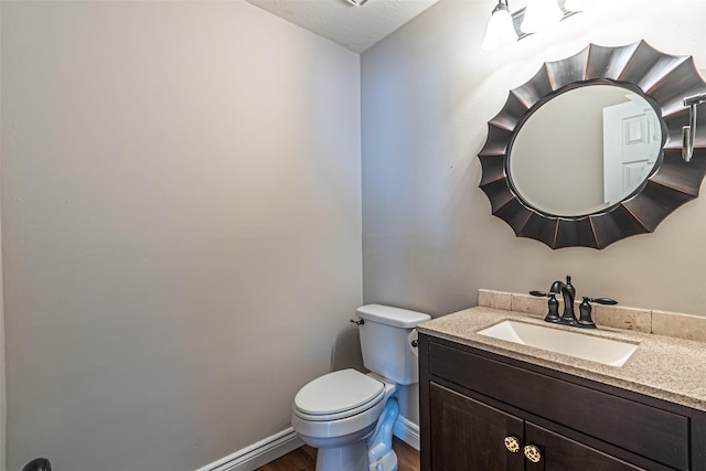 20423 Lone Star Oak St, Cypress, TX 77433 - bathroom with wood finished floors, toilet, vanity, and baseboards