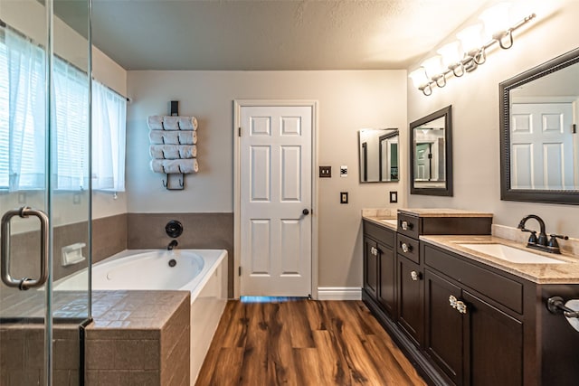 20423 Lone Star Oak St, Cypress, TX 77433 - bathroom featuring a garden tub, wood finished floors, vanity, and a shower stall