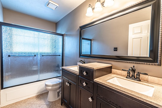 20423 Lone Star Oak St, Cypress, TX 77433 - full bathroom featuring double vanity, toilet, enclosed tub / shower combo, and tile patterned floors