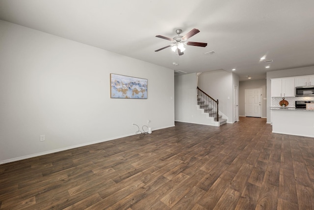 4438 Andorno Dr, Katy, TX 77449 - unfurnished living room with dark wood-style floors, stairway, ceiling fan, baseboards, and recessed lighting
