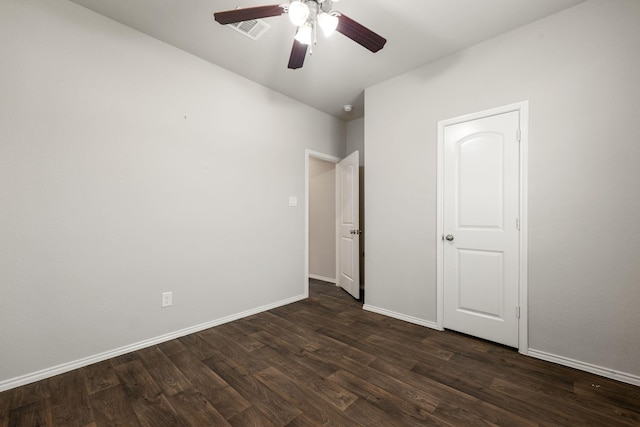 4438 Andorno Dr, Katy, TX 77449 - unfurnished bedroom with dark wood-style flooring, baseboards, and ceiling fan