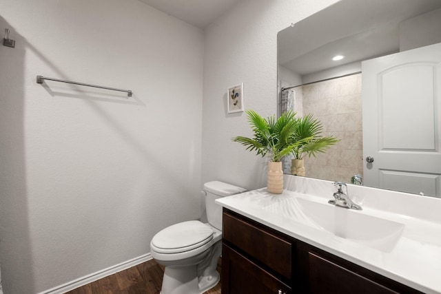 4438 Andorno Dr, Katy, TX 77449 - bathroom featuring wood finished floors, toilet, baseboards, vanity, and a shower with shower curtain