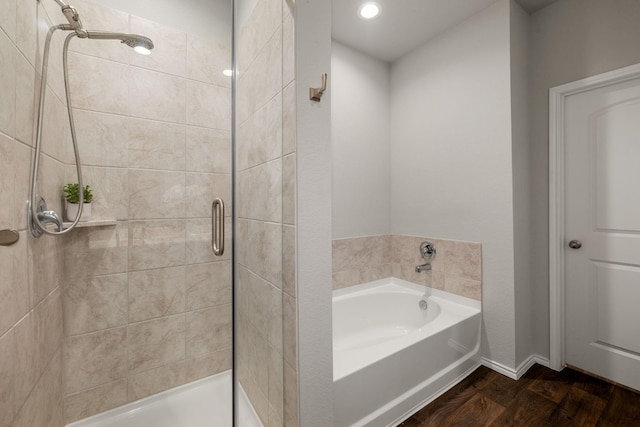 4438 Andorno Dr, Katy, TX 77449 - full bath featuring a stall shower, a garden tub, and wood finished floors