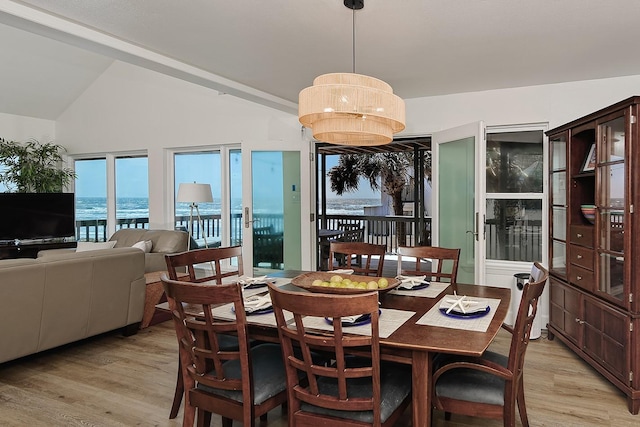 4242 Pelican Ln, Galveston, TX 77554 - dining area featuring light wood finished floors and lofted ceiling