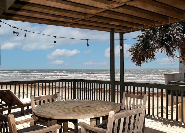 4242 Pelican Ln, Galveston, TX 77554 - wooden terrace featuring view of water and beach