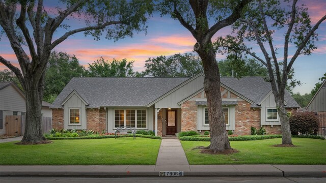 7906 Meadow Lake Ln, Houston, TX 77063 - view of front of home featuring roof with shingles, brick siding, and board and batten siding