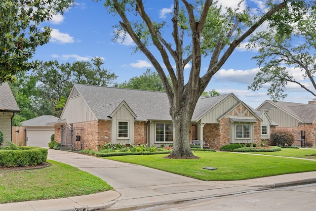 7906 Meadow Lake Ln, Houston, TX 77063 - view of front of home featuring brick siding, roof with shingles, a front lawn, and a garage