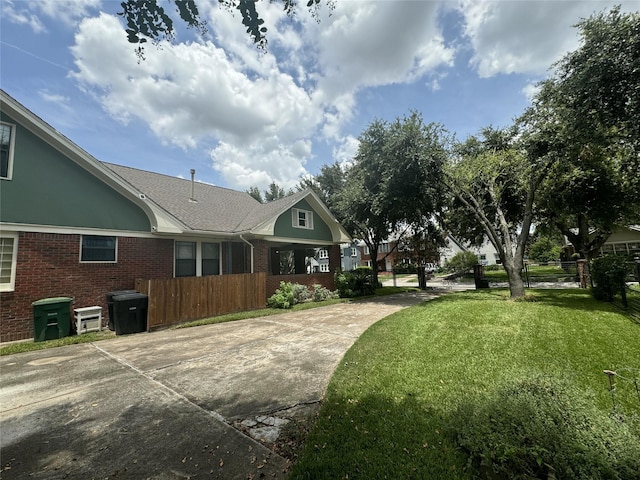 view of property exterior with brick siding