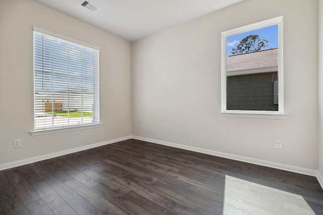 16449 Blossom Grove Dr, Conroe, TX 77303 - spare room featuring dark wood-style floors and baseboards