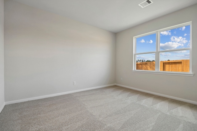 16449 Blossom Grove Dr, Conroe, TX 77303 - empty room featuring baseboards and light colored carpet