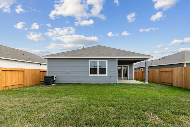 16449 Blossom Grove Dr, Conroe, TX 77303 - rear view of property with a patio area, a shingled roof, and central air condition unit