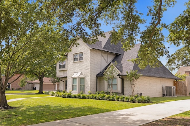 10830 Piping Rock Ln, Houston, TX 77042 - view of front of home featuring brick siding, roof with shingles, and central AC unit