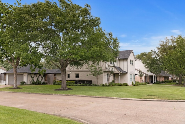 10830 Piping Rock Ln, Houston, TX 77042 - view of front of home featuring a front yard, concrete driveway, and brick siding