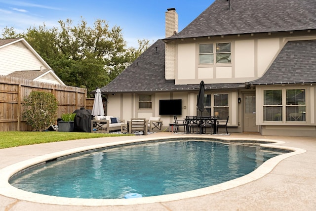 10830 Piping Rock Ln, Houston, TX 77042 - view of swimming pool with fence, a patio area, an outdoor hangout area, and outdoor dining area