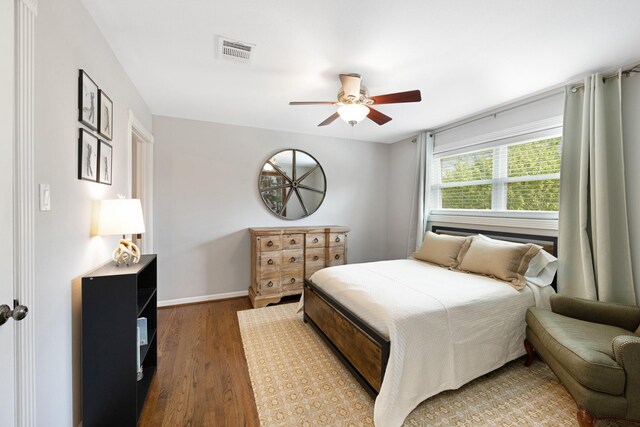 10830 Piping Rock Ln, Houston, TX 77042 - bedroom with wood finished floors, baseboards, and ceiling fan