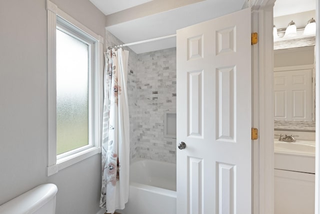 10830 Piping Rock Ln, Houston, TX 77042 - full bathroom featuring healthy amount of natural light, toilet, shower / tub combo, and vanity
