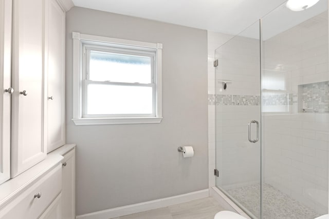 10830 Piping Rock Ln, Houston, TX 77042 - full bath with a stall shower and baseboards