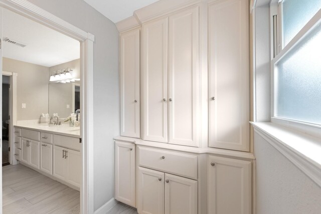10830 Piping Rock Ln, Houston, TX 77042 - bathroom featuring vanity and wood finished floors
