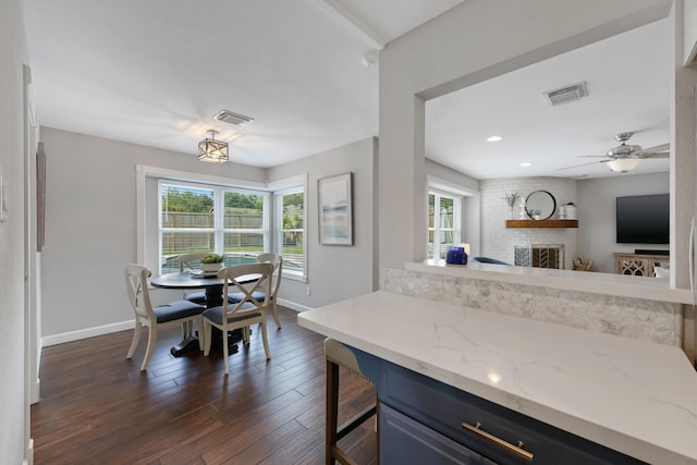10830 Piping Rock Ln, Houston, TX 77042 - kitchen featuring baseboards, a brick fireplace, dark wood-type flooring, ceiling fan, and recessed lighting