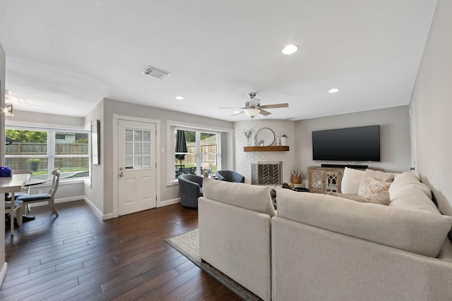 10830 Piping Rock Ln, Houston, TX 77042 - living area with baseboards, ceiling fan, dark wood-style floors, a fireplace, and recessed lighting