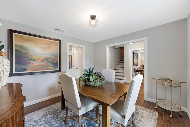 10830 Piping Rock Ln, Houston, TX 77042 - dining area featuring stairway, baseboards, and wood finished floors