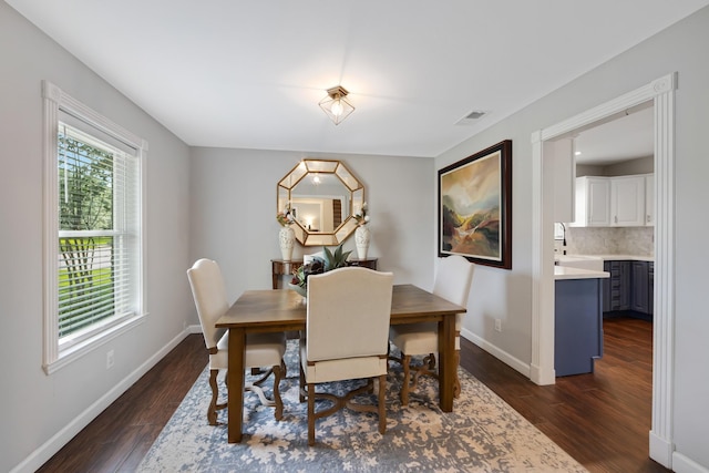 10830 Piping Rock Ln, Houston, TX 77042 - dining area with dark wood-type flooring and baseboards