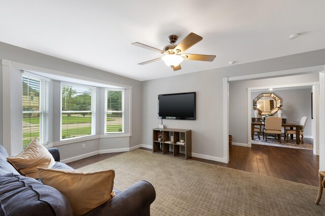 10830 Piping Rock Ln, Houston, TX 77042 - living room with baseboards, wood finished floors, and ceiling fan