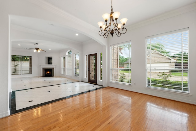 7615 Brae Acres Ct, Houston, TX 77074 - foyer with healthy amount of natural light, a chandelier, ornamental molding, baseboards, and wood-type flooring