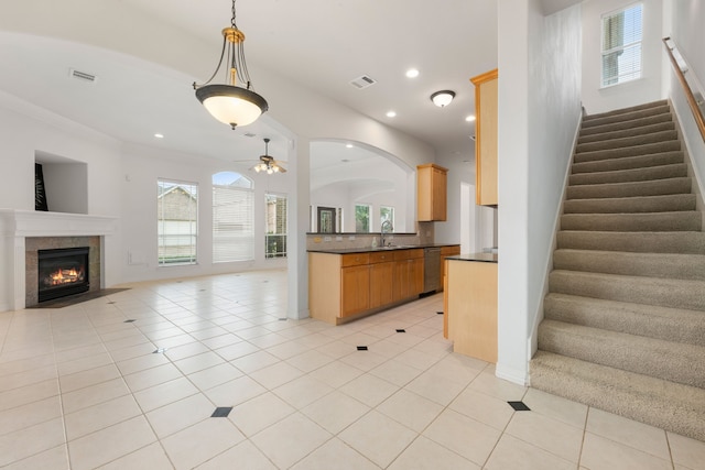 7615 Brae Acres Ct, Houston, TX 77074 - kitchen featuring dark countertops, dishwasher, a ceiling fan, open floor plan, and healthy amount of natural light