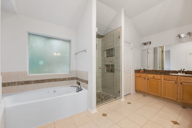 7615 Brae Acres Ct, Houston, TX 77074 - full bath with tile patterned floors, a garden tub, vanity, a shower stall, and vaulted ceiling