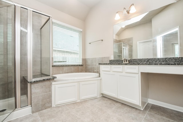 7718 Collina Landing Trl, Richmond, TX 77407 - bathroom featuring a stall shower, tile patterned flooring, a garden tub, vanity, and lofted ceiling