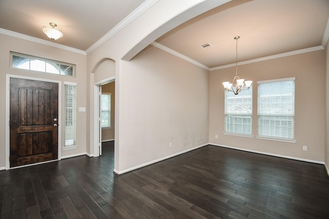 7718 Collina Landing Trl, Richmond, TX 77407 - entryway featuring dark wood-style floors, a chandelier, crown molding, arched walkways, and baseboards
