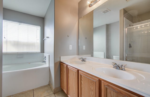 19835 Byron Meadows Dr, Katy, TX 77449 - full bath with a stall shower, double vanity, tile patterned flooring, toilet, and a bath