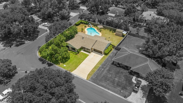 1001 Windy Dr, Brenham, TX 77833 - aerial view of property and surrounding area with property parcel outlined and a pool area